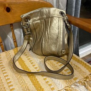 B Makowsky Durango Pebbled leather gold crossbody, oval shape bottom